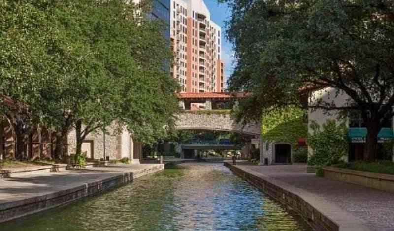 Mandalay Canal in Las Colinas showing pedestrian walkways and canal infrastructure within a mixed-use urban development
